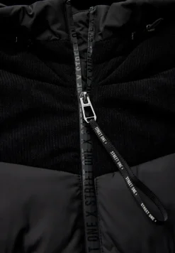Veste à structure mixte