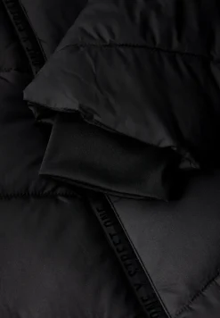 Veste à structure mixte