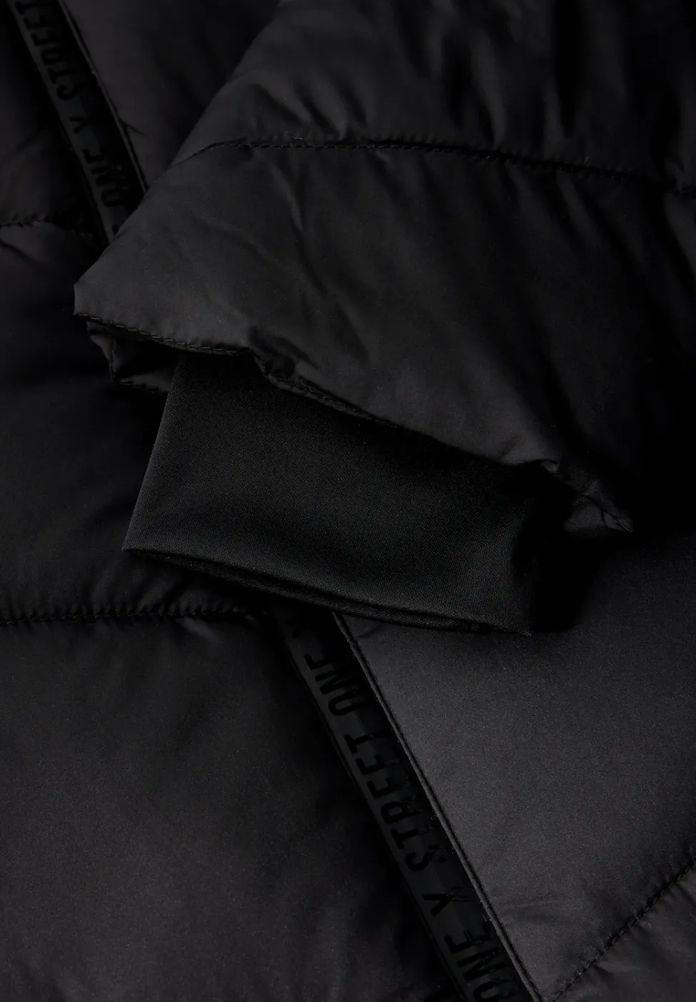 Veste à structure mixte